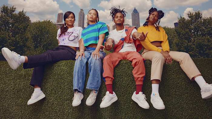 Models wear white New Balance shoes in Atlanta.